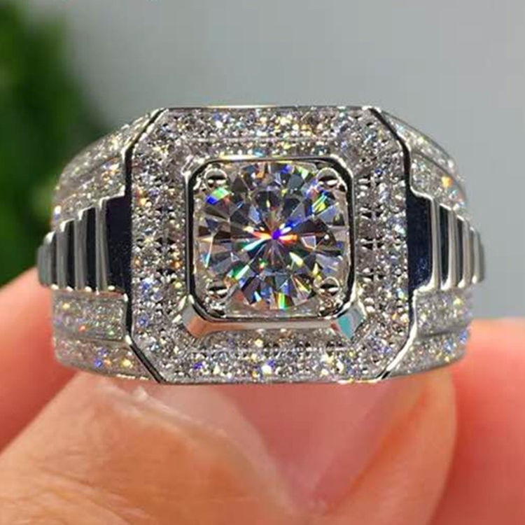Men's moissanite wedding band on hand