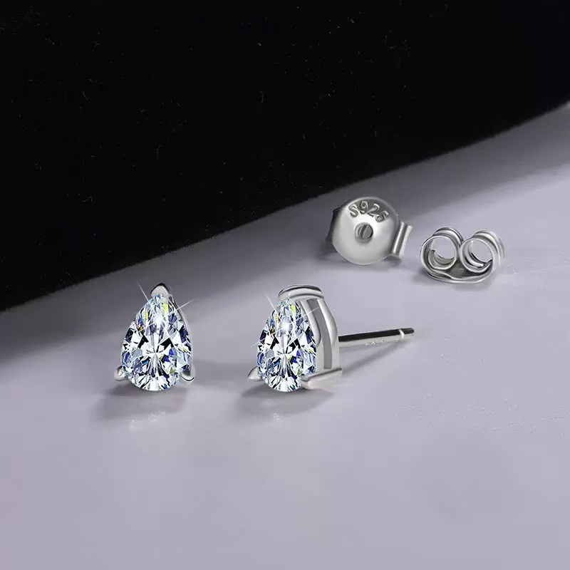 S925 stamp and three prong setting on pear moissanite earrings