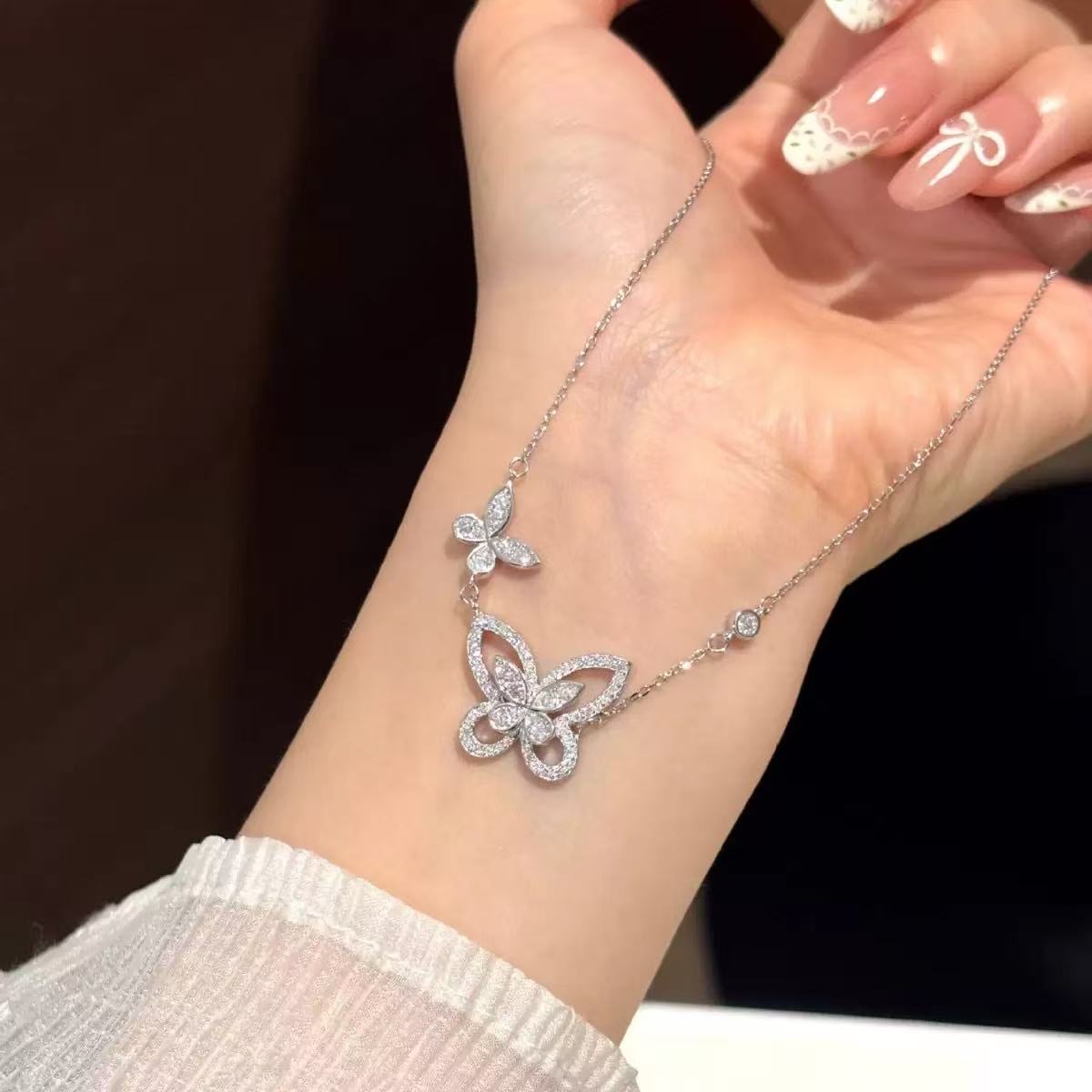 Double butterfly moissanite necklace detail in S925 silver