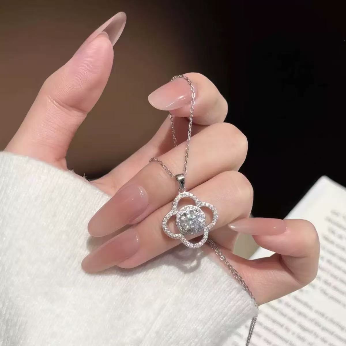Modern four-leaf clover moissanite necklace detail