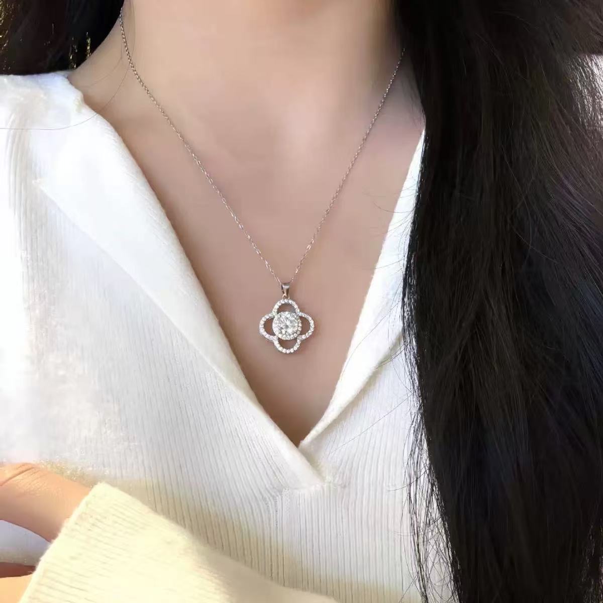 Modern four-leaf clover moissanite necklace on model
